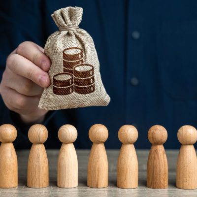 A,Man,Holds,Money,Bag,Of,Coins,Above,The,Crowd.